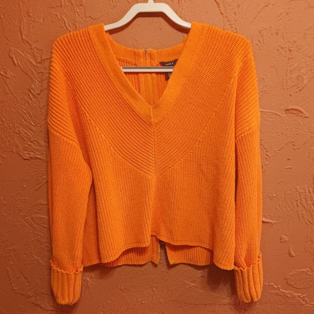Orange sweater with oversized sleeves